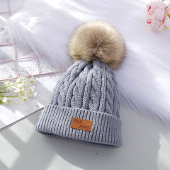 children in winter clothing with beanie hats
