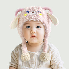 Toddler wearing a cute plush winter beanie