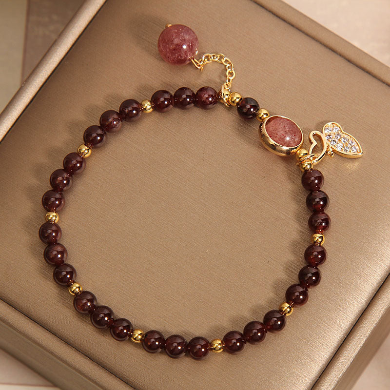 Vintage garnet bracelet showcasing butterfly design
