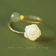 Elegant rose flower ring against a neutral background