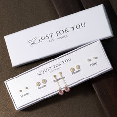 variety of silver earrings displayed image 3