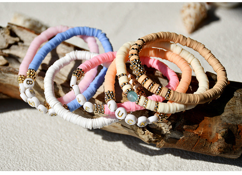 Fashionable clay bracelet on a white background