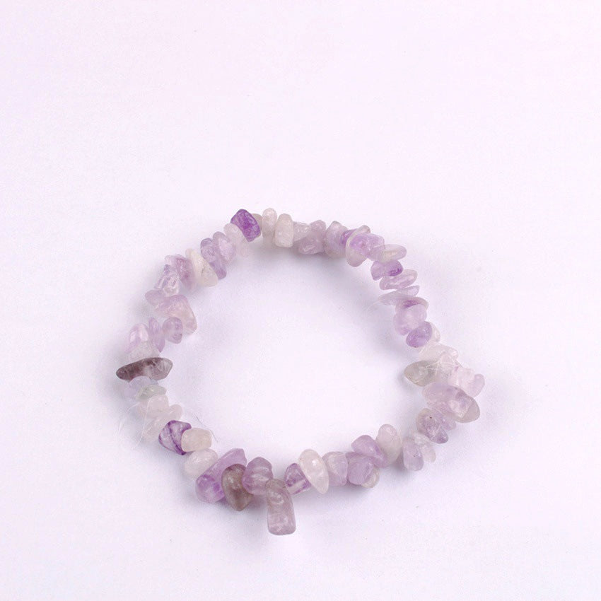 Close-up of colourful crystal charms on bracelet