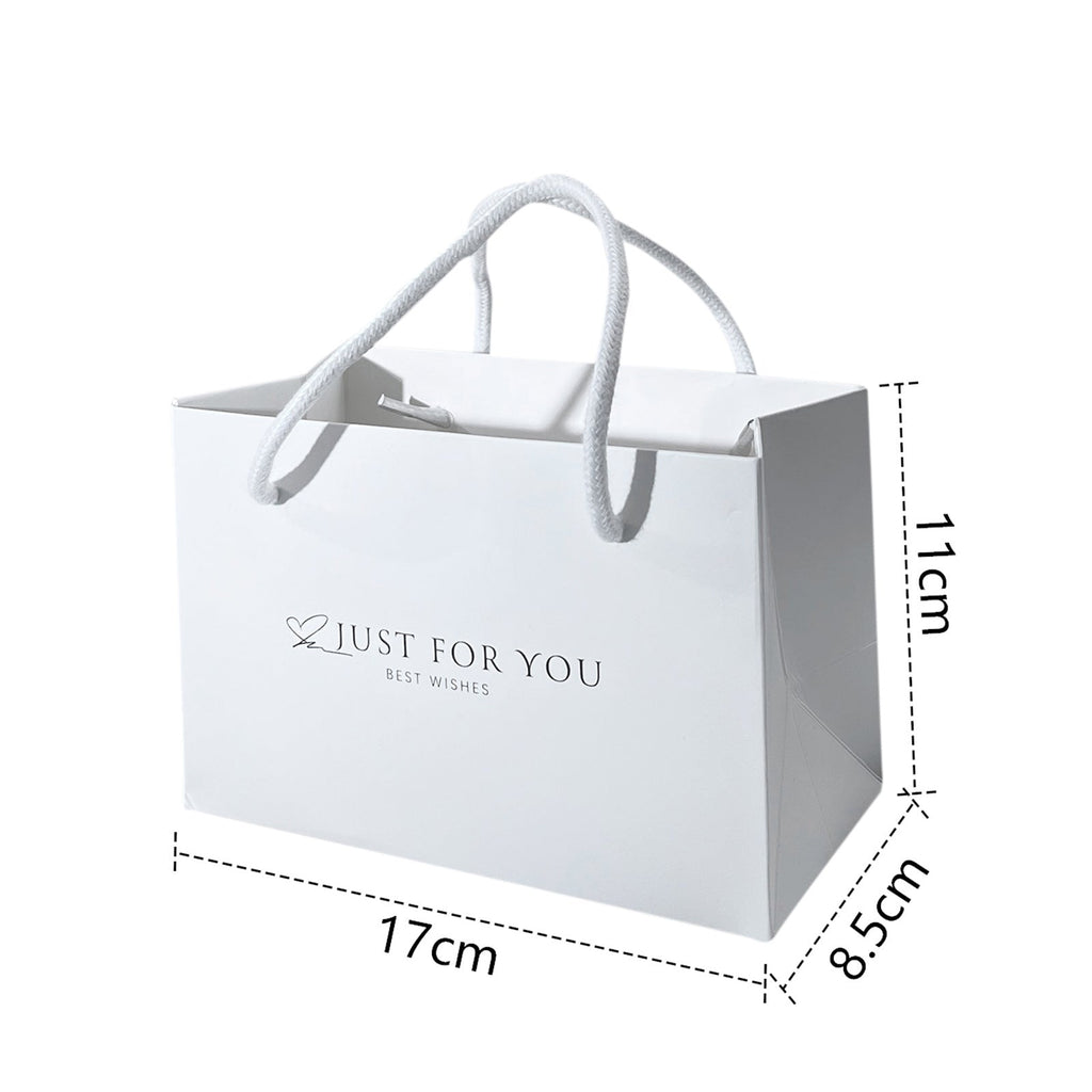 Elegant gift presentation with ribbons and tags