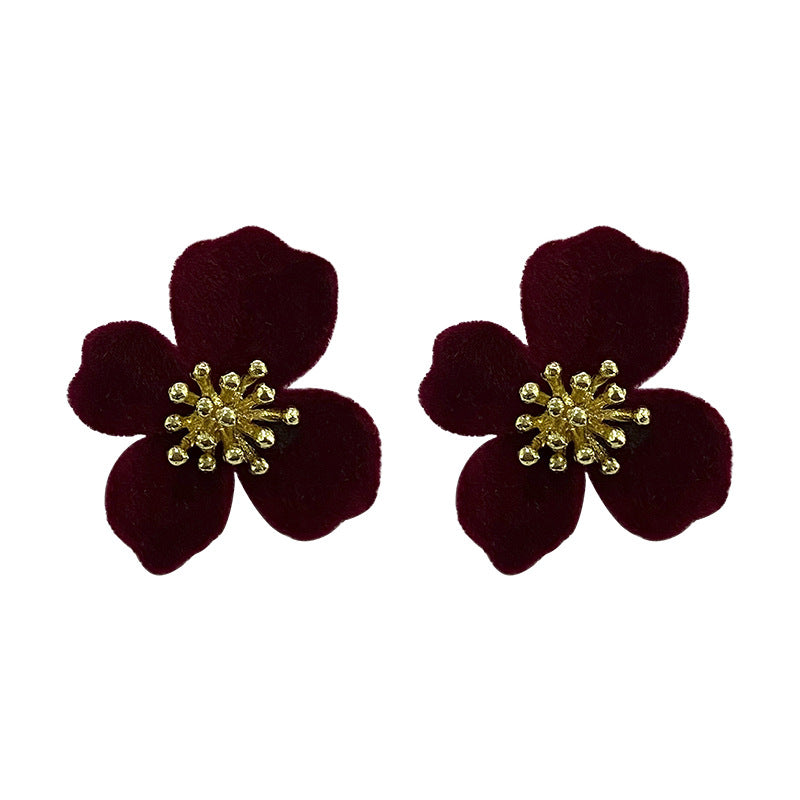 Chic Velvet Earrings on a wooden background