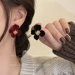 Close-up of premium velvet floral design earrings