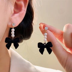 Image of elegant red velvet bow earrings