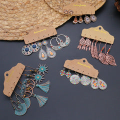 Geometric tassel earrings shown in three pairs