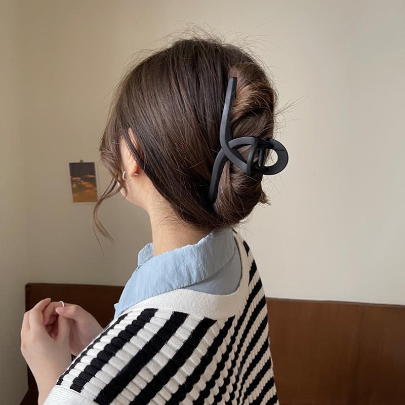 Close-up view of matte grey hair claw clip for women