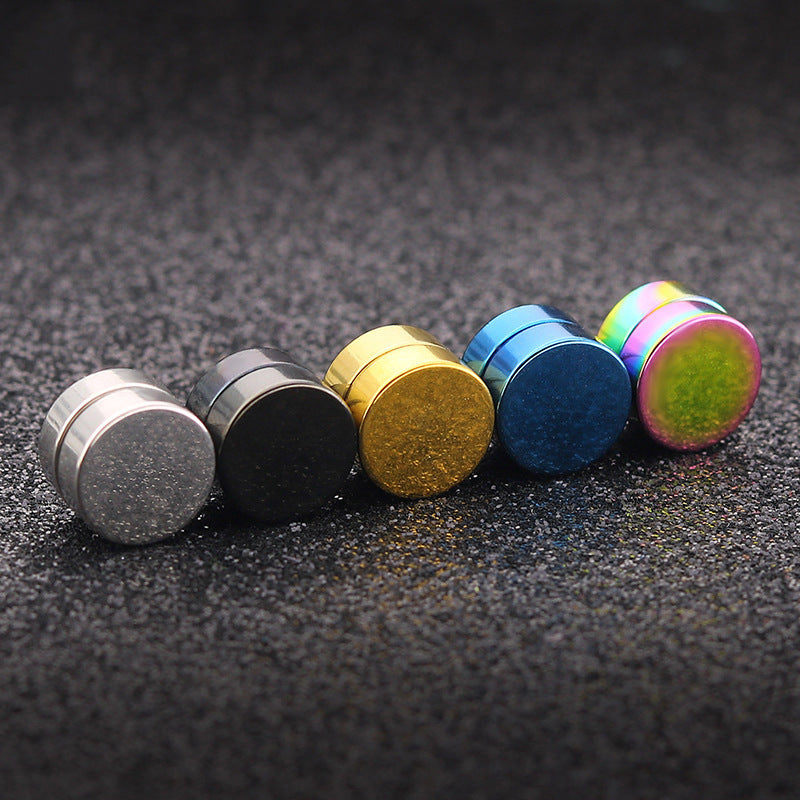 Black titanium magnetic ear studs showcased on a hand
