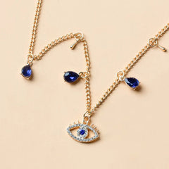 Gold-Plated Crystal Evil Eye Necklace on a necklace stand
