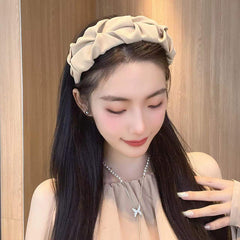 Close-up of stylish wrinkled wide hairband fabric