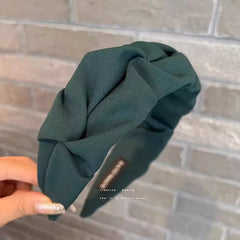 Close-up of stylish wrinkled wide hairband fabric