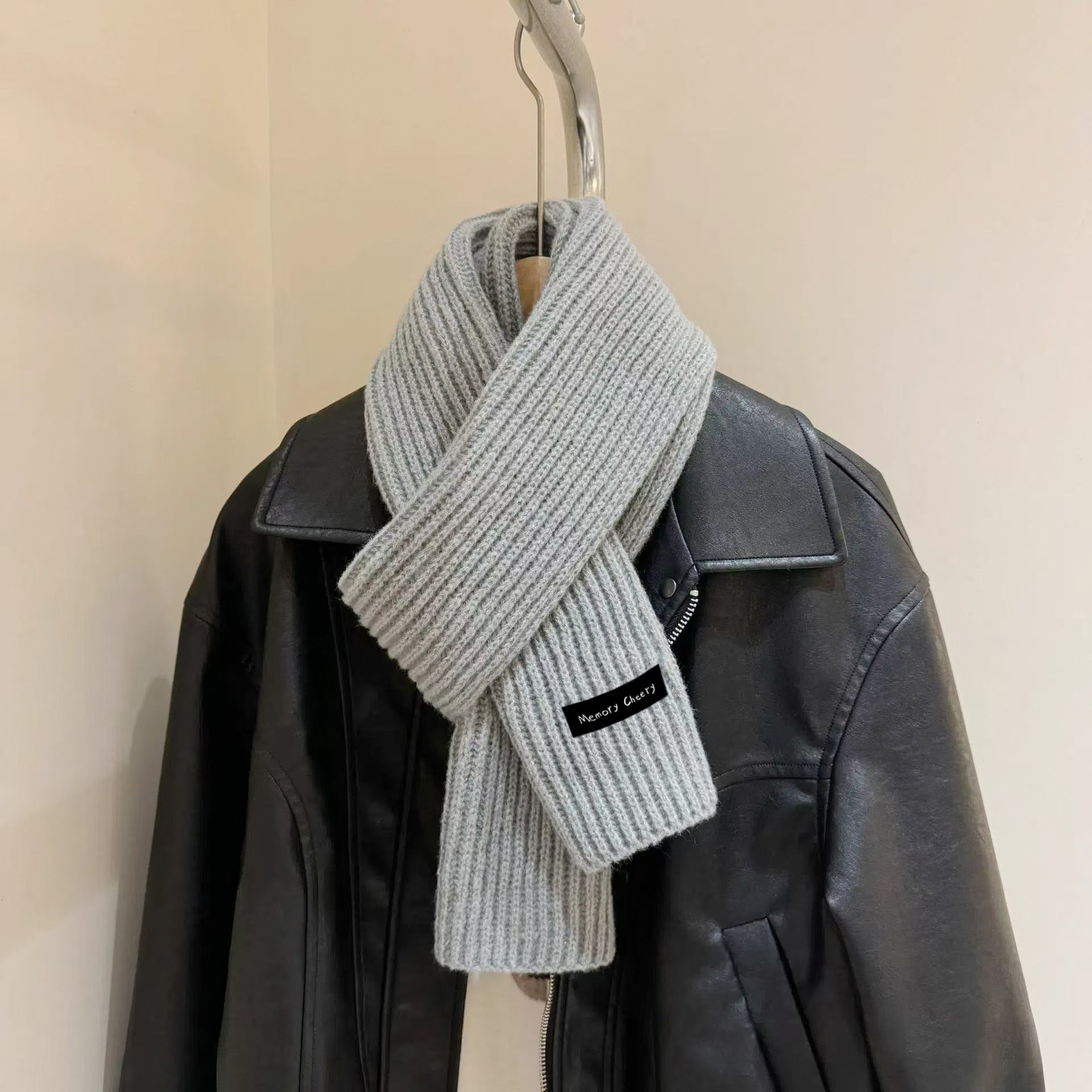 Fashionable blue knitted scarf for winter outfits