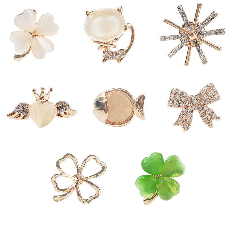 Fashionable cat eye stone brooch with unique designs