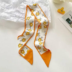 yellow scarf tied to bag