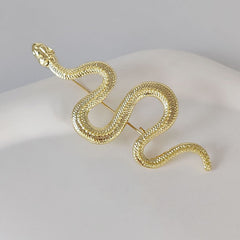 Stylish snake brooch on a grey suit