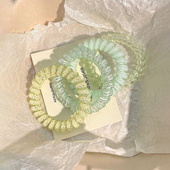 Close-up of hair tie in Strawberry colour