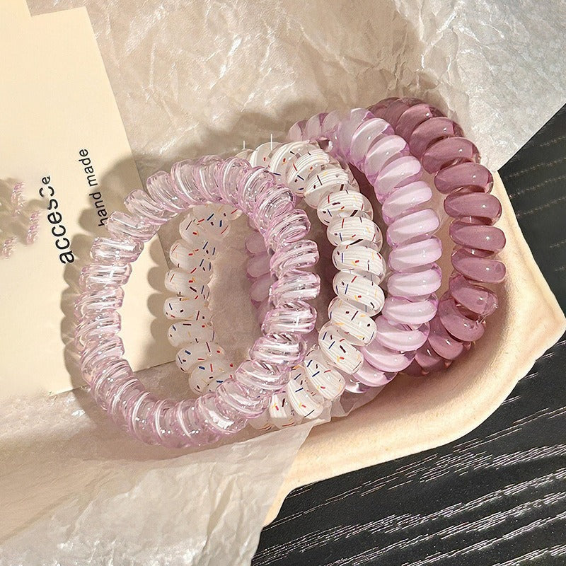 Casual hairstyle using phone line hair ties