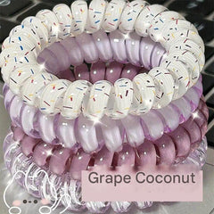 Grape colour hair tie shown on a surface