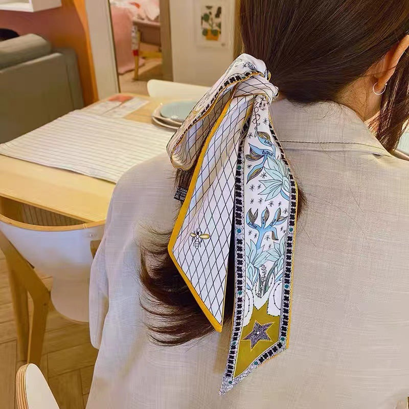 detailed view of fabric and print of faux silk scarf 5