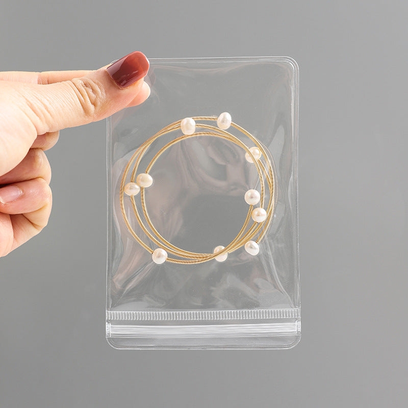 Compact travel jewellery organiser with compartments