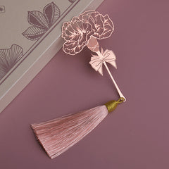 Elegant bookmark resting next to books