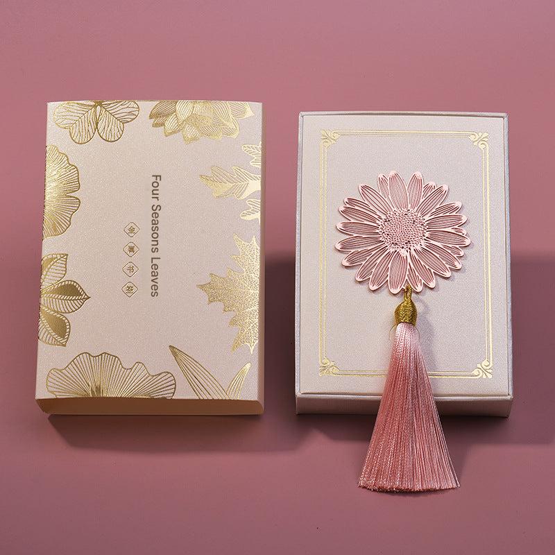 Elegant metal bookmark with intricate designs